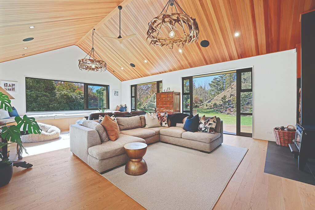 Living room of the rural homestead in North Canterbury, with a vaulted cedar ceiling and garden outlook.